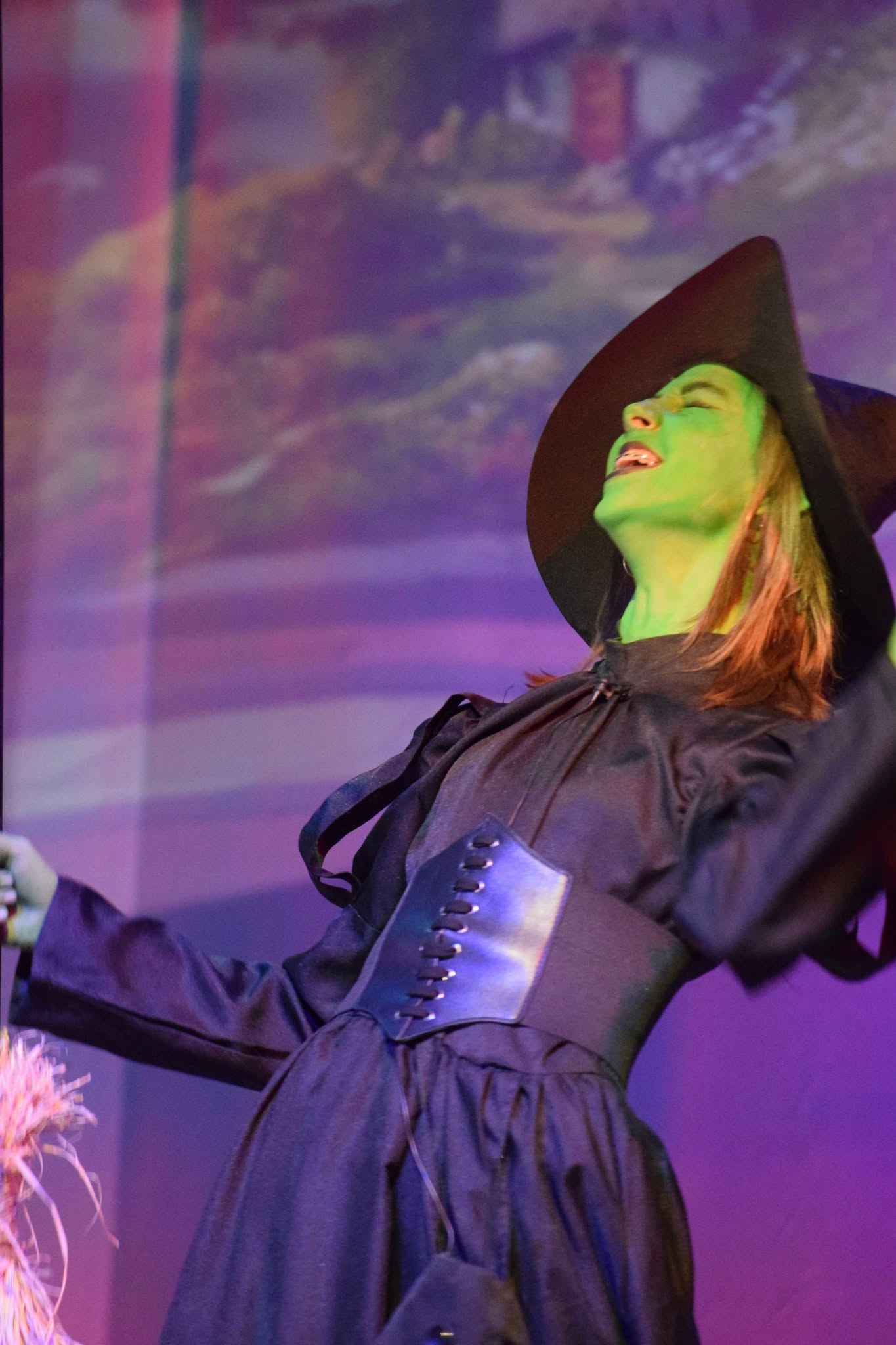 Student performing as the Wicked Witch in Hawbridge’s production of The Wizard of Oz.